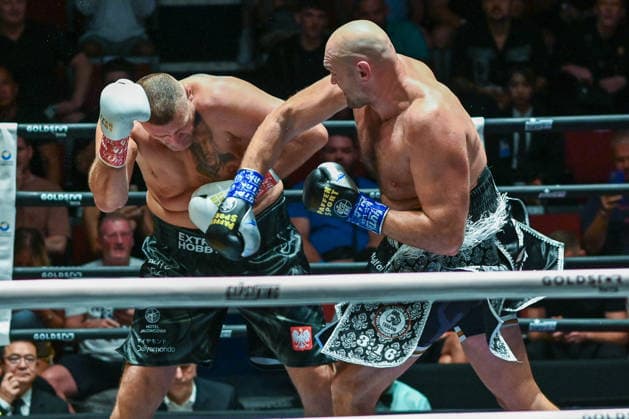 July 24, 2026, Pattaya, Chonburi, Thailand: Tyson Fury (L) and Mariusz Wach (R) exchanging punches during their heavyweight boxing bout. Tyson Fury defeats Mariusz Wach by corner retirement after seven rounds to win the WBC Humanitarian Belt at Max Muay Thai Stadium. Pattaya Thailand - ZUMAs197 20260724_aaa_s197_100 Copyright: xWasimxMatherx