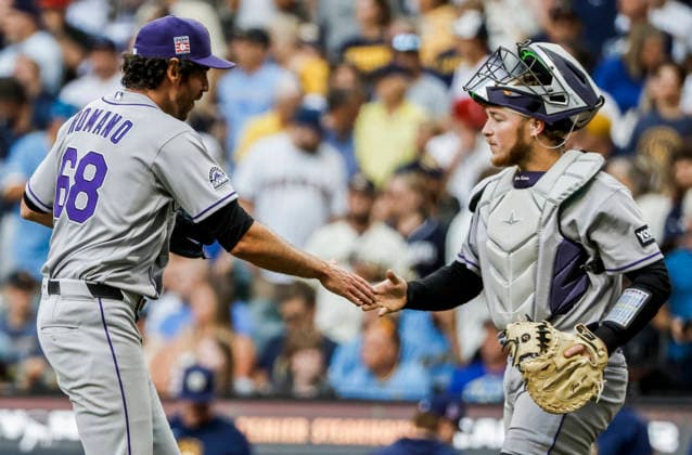Colorado Rockies relief pitcher Jordan Romano (L) and Colorado Rockies catcher Hunter Goodman celebrate after the final out in the ninth inning of the MLB, Baseball Herren, USA game between the Colorado Rockies and the Milwaukee Brewers at American Family Field in Milwaukee, Wisconsin on Friday July 24, 2026. The Rockies defeated the Brewers 5-2.  MIL20260724835 TANNENxMAURY