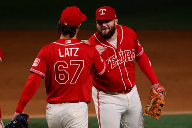 July 24, 2026, Arlington, Texas, USA: Texas Rangers first baseman JAKE BURGER (21) congratulates Texas Rangers pitcher JACOB LATZ (67) after a save. Friday, July 24, 2026, in Arlington, Texas. Arlington USA - ZUMAa325 20260724_zsa_a325_007 Copyright: xDavidxBalleringxIix