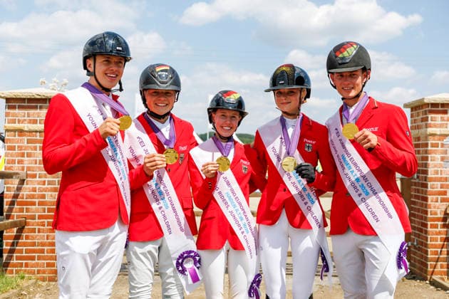 HAGEN a.T.W. - FEI Jumping European Championship, EM, Europameisterschaft Children, Juniors and Young Rider 2026, HAGEN a.T.W. - FEI Jumping European Championship Children, Juniors and Young Rider 2026 Team Germany TILLMANN Lennard (GER), STORMANNS Tony (GER), MERSCHFORMANN Malte (GER), BEERBAUM Brianne (GER), KUEHNER Jolie Marie (GER), SEEMANN Eberhard (Chef dÂ Equipe) Championship ceremony Team Final Nations Cup CH-EU-J-S - Juniors 2nd COMPETITION Teams & Individuals over two rounds - SECOND ROUND Hagen a.T.W., Reitanlage Haunhorst 25. July 2026 - *** HAGEN a T W FEI Jumping European Championship for Children, Juniors, and Young Riders 2026, HAGEN a T W FEI Jumping European Championship for Children, Juniors, and Young Riders 2026 Team Germany: Lennard TILLMANN (GER), Tony STORMANNS (GER), Malte MERSCHFORMANN (GER), Brianne BEERBAUM (GER), KUEHNER Jolie Marie GER, SEEMANN Eberhard, Chef d’Equipe Championship Ceremony Team Final Nations Cup CH EU J S Juniors 2nd COMPETITION Teams Individuals over two rounds SECOND ROUND Hagen a T W, Haunhorst Equestrian Center, July 25, 2026