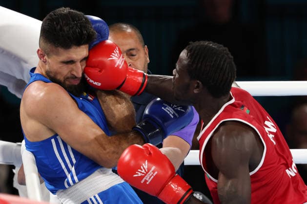 July 25, 2026, Glasgow, Scotland, Great Britain: HAPPY NGWIRA of Malawi (red) lands a punch on ZALAAN JAN of Antigua and Barbuda (blue) in the Men s 80kg - Round of 32 of the Commonwealth Games Glasgow 2026 at the SEC Hall 5 in Glasgow, Scotland Commowealth Games 2026: Boxing  - ZUMAc179 20260725_zep_c179_020 Copyright: xMickaelxChavetx