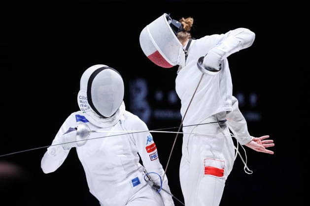 CHINA, HONG KONG - JULY 25, 2026: Italy s Giulia Rizzi (L) and Poland s Barbara Brych compete in the ladies individual epee event at the 2026 Kerry Fencing World Championships. Mikhail Sinitsyn TASS  95430980
