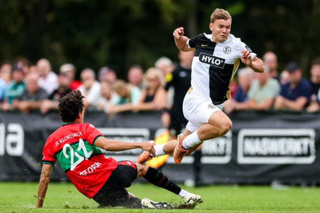 WEURT, NETHERLANDS - JULY 25: Deveron Fonville of NEC Nijmegen fouls Lasse Gunther of SV Elversberg during the pre-season friendly match between NEC and Elversberg at Sportpark De Kamp on July 25, 2026 in Weurt, Netherlands.  Copyright: xRenexNijhuis MBxMediax