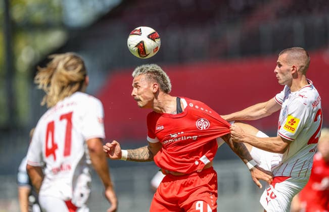 GER, Mainz, FSV Mainz 05 vs Holstein Kiel, Vorbereitung, Fussball, DFB, Spielzeit 2026 2027, Bruchwegstadion auf dem Wolfgang Frank Campus, Testspiel im Bild v.l.: Phillip Tietz (FSV Mainz 05 9), Adrian Kapralik (Holstein Kiel 20), Zweikampf DFB DFL REGULATIONS PROHIBIT ANY USE OF PHOTOGRAPHS AS IMAGE SEQUENCES AND OR QUASI-VIDEO, 25.07.2026 *** GER, Mainz, FSV Mainz 05 vs. Holstein Kiel, Preseason, Soccer, DFB, 2026–2027 Season, Bruchwegstadion on the Wolfgang Frank Campus, Friendly Match: Pictured from left: Phillip Tietz (FSV Mainz 05) 9, Adrian Kapralik, Holstein Kiel 20, tackle. DFB and DFL regulations prohibit any use of photographs as image sequences and or quasi-video. July 25, 2026 Copyright: HMBxMedia HendrikxHamelau