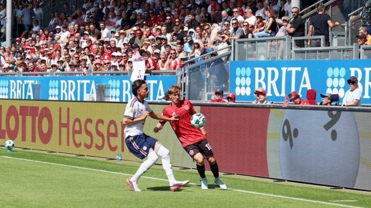 25.07.2026, xrekx, Fussball Testspiel, SV Wehen Wiesbaden - FC Bayern München v.l. Adam El Chaar (FC Bayern Muenchen) Fabian Greilinger (SV Wehen Wiesbaden) Fans ,Stimmung, Schals, Ultras, Zuschauer, Besucher, Choreo, Choreografie, atmosphere, scarves, spectators, visitors (DFL DFB REGULATIONS PROHIBIT ANY USE OF PHOTOGRAPHS as IMAGE SEQUENCES and or QUASI-VIDEO) Wiesbaden *** July 25, 2026, xrekx, Soccer Friendly Match, SV Wehen Wiesbaden vs. FC Bayern Munich, Adam El Chaar, FC Bayern Munich, Fabian Greilinger, SV Wehen Wiesbaden, Fans, Atmosphere, Scarves, Ultras, Spectators, Visitors, Choreography, choreography, atmosphere, scarves, spectators, visitors DFL DFB REGULATIONS PROHIBIT ANY USE OF PHOTOGRAPHS as IMAGE SEQUENCES and or QUASI-VIDEO Wiesbaden