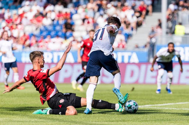 WIESBADEN, GERMANY - JULY 25: Tim Binder (FC Bayern Muenchen, 31) controls the ball against Justin Janitzek (SV Wehen Wiesbaden, 15) - penalty foul - during the friendly game between SV Wehen Wiesbaden vs. FC Bayern Muenchen at BRITA Arena on July 25, 2026 in Wiesbaden, Germany. Hessen Germany Copyright: xSteffiexWunderlx