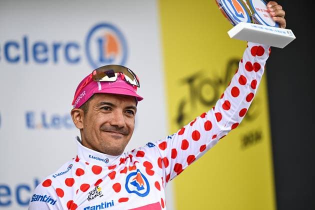 Ecuadorian Richard Carapaz of EF Education-EasyPost celebrates on the podium in the red polka-dot jersey for best climber after stage 20 of the 2026 Tour de France cycling race, a stage of 171km Le Bourg d Oisans to Alpe d Huez, on Saturday 25 July 2026. The 113th edition of the Tour de France starts on Saturday 4 July in Barcelona, Spain, and will finish in Paris, France on the 26th of July. DAVIDxPINTENS  x182017892x