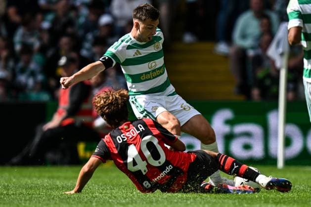 Kieran Tierney of Celtic is tackled by Lorenzo Ossola of AC Milan during the pre season friendly match between Celtic and AC Milan at Celtic Park, Glasgow, Scotland on Saturday 25th July 2026. Celtic v AC Milan, Pre Season Friendly, Football, Celtic Park, Glasgow, Scotland, UK - 25 Jul 2026Glasgow Celtic Park United Kingdom  Copyright: xAndyxBuchanan Shutterstockx 17004340bw