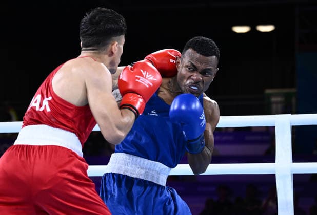 COM26 BOXING, Qudrat Ullah of Pakistan fights Jone Davule of Fiji during the Men™s 60kg Round of 32 match on Day two of the Glasgow 2026 Commonwealth Games at the SEC Centre in Glasgow, Scotland, Saturday, July 25, 2026. ( NO ARCHIVING, EDITORIAL USE ONLY Glasgow United Kingdom  Copyright: xJOELxCARRETTx 20260726196967957023