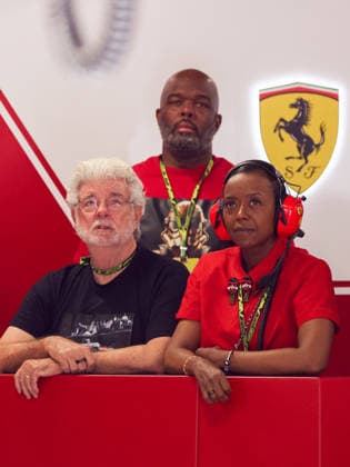 July 25, 2026, Budapest, Hungary: Film director George Lucas and his wife Mellody Louise Hobson Lucas are seen in a garage of Lewis Hamilton of Ferrari prior to the qualifying session ahead Formula 1 Hungarian Grand Prix at the Hungaroring circuit in Mogyorod near Budapest on July 25th, 2026. F1 2026: Hungarian Grand Prix  - ZUMAz156 0862646937st Copyright: xBeataxZawrzelx