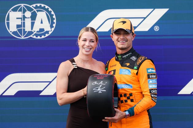 July 25, 2026, Budapest, Hungary: Lando Norris of McLaren and Michelle Gulyas pose for a picture after qualifying ahead Formula 1 Hungarian Grand Prix at the Hungaroring circuit in Mogyorod near Budapest on July 25th, 2026. F1 2026: Hungarian Grand Prix  - ZUMAz156 0862649523st Copyright: xBeataxZawrzelx