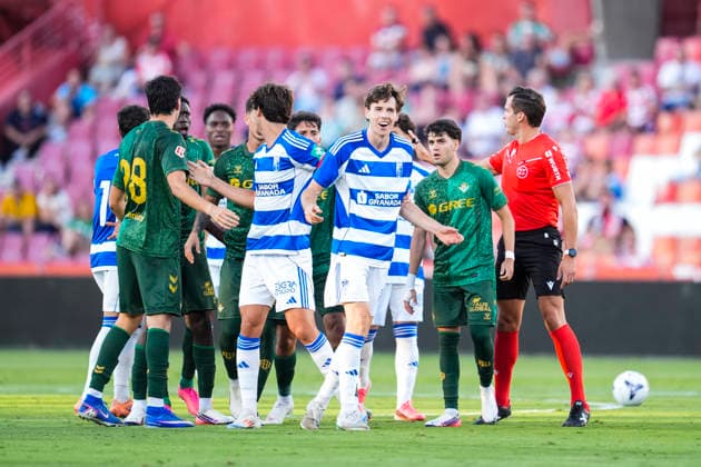 July 25, 2026, Granada, Granada, Spain: Bouare of Real Betis and Gerard Gumbau of Granada CF exchange words during the Ciudad de Granada Trophy football match played between Granada CF and Real Betis at Nuevo Los Carmenes stadium on July 25, 2026, in Granada, Spain. Granada Spain - ZUMAa181 20260725_zaa_a181_029 Copyright: xJoaquinxCorcherox