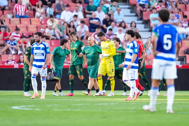 July 25, 2026, Granada, Granada, Spain: Diego Conde of Real Betis is attended to by medical staff during the Ciudad de Granada Trophy football match played between Granada CF and Real Betis at Nuevo Los Carmenes stadium on July 25, 2026, in Granada, Spain. Granada Spain - ZUMAa181 20260725_zaa_a181_031 Copyright: xJoaquinxCorcherox