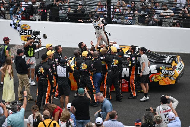 INDIANAPOLIS, IN - JULY 25: Carson Kvapil ( 1 JR Motorsports Wilde Protein Crackers Chevrolet) dives onto his crew after winning the NASCAR, Motorsport, USA OÕReilly Auto Parts Series Pennzoil 250 on July 25, 2026, at Indianapolis Motor Speedway in Indianapolis, Indiana. (Photo by Michael Allio Icon Sportswire) AUTO: JUL 25 NASCAR OÕReilly Auto Parts Series Pennzoil 250 EDITORIAL USE ONLY Icon116260725022250