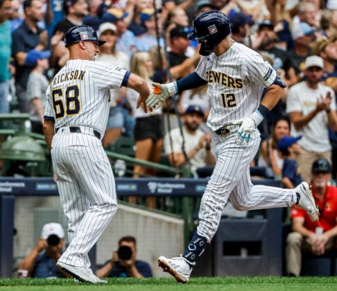 Milwaukee Brewers shortstop Cooper Pratt (R) celebrates with Milwaukee Brewers third base coach Matt Erickson after hitting a home run in the second inning of the MLB, Baseball Herren, USA game between the Colorado Rockies and the Milwaukee Brewers at American Family Field in Milwaukee, Wisconsin on Saturday July 25, 2026.  MIL20260725805 TANNENxMAURY
