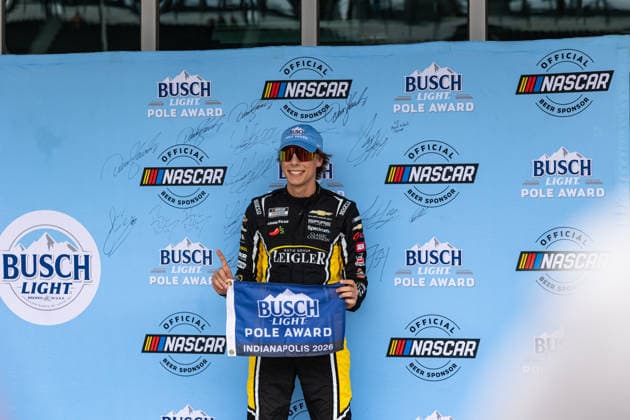 July 25, 2026, Indianapolis, Indiana, USA: CARSON HOCEVAR (77) - Spire Motorsports poses after signing his name on the Busch Light Pole Award mural after qualifying for the 30th running of the NASCAR, Motorsport, USA Cup Series Brickyard 400 in pole position. Indianapolis USA - ZUMAs355 20260725_zsp_s355_035 Copyright: xJustinxSickingx
