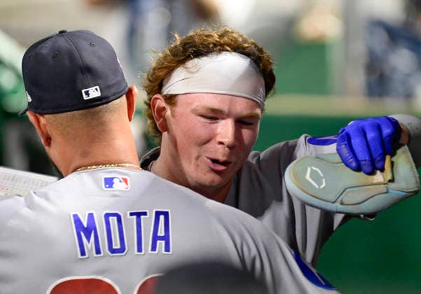 Chicago Cubs second baseman James Triantos (5) celebrates scoring in the dugout during his Major League debut against the Pittsburgh Pirates during the eight inning of the Cubs 11-0 in the at PNC Park on Saturday, July 25, 2026 in Pittsburgh.  PIT2026072516 ArchiexCarpenter