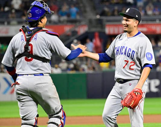 Chicago Cubs catcher Miguel Amaya (9) congratulates Chicago Cubs pitcher Javier Assad (72) after closing out the Cubs 11-0 win against the Pittsburgh Pirates in the at PNC Park on Saturday, July 25, 2026 in Pittsburgh.  PIT2026072521 ArchiexCarpenter
