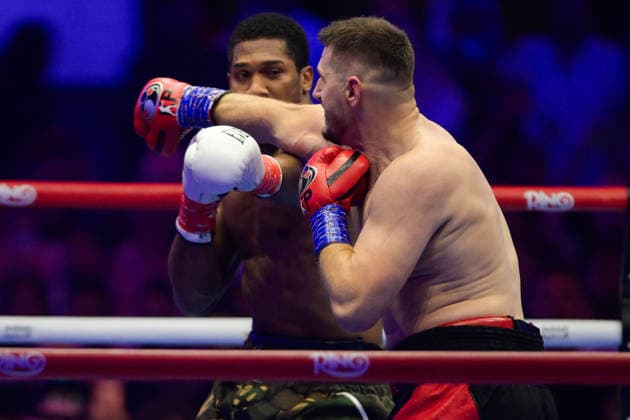 JEDDAH, SAUDI ARABIA - JULY 25: Kristian Prenga (red, black and gold shorts) and Anthony Joshua (military camouflage shorts) exchange punches during the Heavyweight contest fight between Anthony Joshua and Kristian Prenga in the Anthony Joshua v Kristian Prenga: The Comeback fight night at Jeddah Superdome on July 25, 2026 in Jeddah, Saudi Arabia.  Copyright: xKhalidxAlhaj MBxMediax