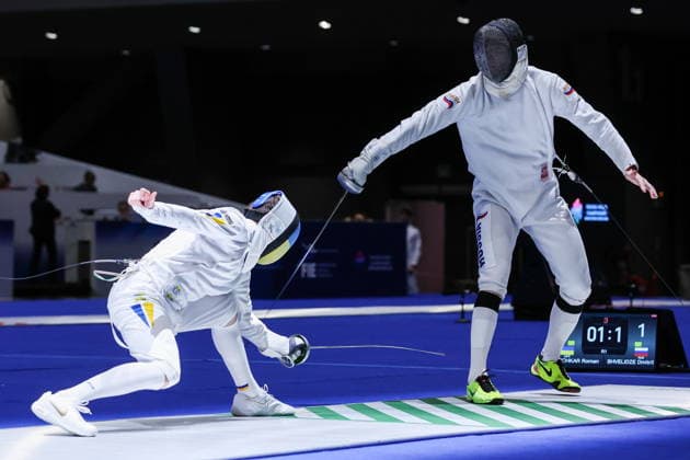 CHINA, HONG KONG - JULY 26, 2026: Ukraine s Roman Svichkar (L) and Russia s Dmitry Shvelidze compete in the men s individual epee event at the 2026 Kerry Fencing World Championships. Mikhail Sinitsyn TASS  95477427