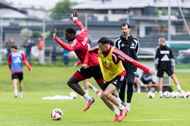 ST. JOHANN IN TIROL, AUSTRIA - JULY 26: Ragnar Ache (1. FC Koeln, 9) and Paul Okon-Engstler (1. FC Koeln, 23) battle for the ball during a training session at trainings camp in Kitzbuehel of season 2026 27 at Koasastadion on July 26, 2026 in St. Johann in Tirol, Austria. Austria Copyright: xSteffiexWunderlx