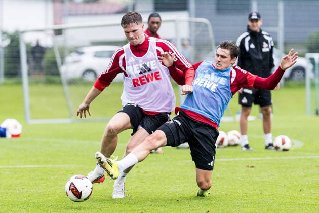 ST. JOHANN IN TIROL, AUSTRIA - JULY 26: Marius Buelter (Bülter, Bulter, 1. FC Koeln, 30) and Alessio Castro-Montes (1. FC Koeln, 17) battle for the ball during a training session at trainings camp in Kitzbuehel of season 2026 27 at Koasastadion on July 26, 2026 in St. Johann in Tirol, Austria. Austria Copyright: xSteffiexWunderlx