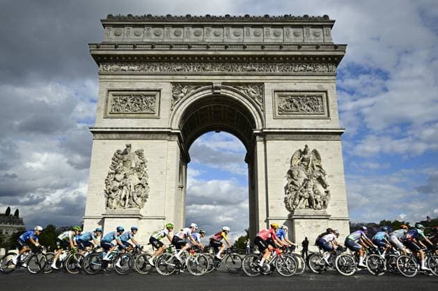 The pack of riders pictured in action in front of Arc De Triomphe during stage 21 of the 2026 Tour de France cycling race, a stage of 130km from Thoiry to Paris Champs-Elysees , on Sunday 26 July 2026. The 113th edition of the Tour de France starts on Saturday 4 July in Barcelona, Spain, and will finish in Paris, France on the 26th of July. JASPERxJACOBS  x182100555x
