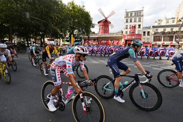 Ecuadorian Richard Carapaz of EF Education-EasyPost pictured in front of The Moulin Rouge pictured during stage 21 of the 2026 Tour de France cycling race, a stage of 130km from Thoiry to Paris Champs-Elysees , on Sunday 26 July 2026. The 113th edition of the Tour de France starts on Saturday 4 July in Barcelona, Spain, and will finish in Paris, France on the 26th of July. DAVIDxPINTENS  x182103372x
