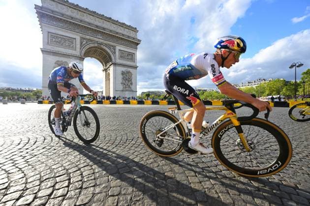 Dutch Mathieu van der Poel of Alpecin-Premier Tech, Belgian Remco Evenepoel of Red Bull-BORA-hansgrohe and pictured in front of Arc De Triomphe during stage 21 of the 2026 Tour de France cycling race, a stage of 130km from Thoiry to Paris Champs-Elysees , on Sunday 26 July 2026. The 113th edition of the Tour de France starts on Saturday 4 July in Barcelona, Spain, and will finish in Paris, France on the 26th of July. DAVIDxPINTENS  x182103950x