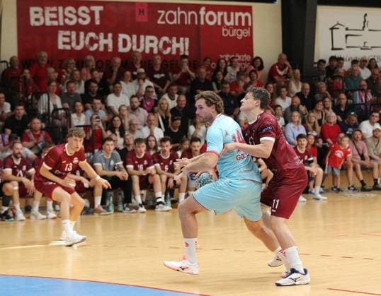 26-07.2026 xmgoodx Offenbach, Handball Männer - 125 Jahre OFC Jubliäumsspiel OFC Kickers gegen MT Melsungen Johannes Golla (14, MT Meslungen) gegen Hofmann, Gero OFC *** July 26, 2026 xmgoodx Offenbach, Men s Handball: OFC s 125th Anniversary Match—OFC Kickers vs. MT Melsungen; Johannes Golla 14, MT Melsungen vs. Hofmann, Gero OFC