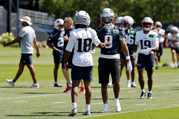 FOXBOROUGH, MA - JULY 26: Kyle Williams 18 of the New England Patriots greets Christian Gonzalez 0 of the New England Patriots during New England Patriots Training Camp on July 26, 2026, at Gillette Stadium in Foxborough, Massachusetts. (Photo by Fred Kfoury III Icon Sportswire) NFL, American Football Herren, USA JUL 26 Patriots Training Camp EDITORIAL USE ONLY Icon482260726034