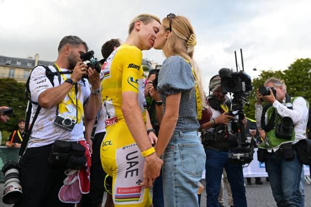 Slovenian Tadej Pogacar and his partner Urska Zigart are pictured after stage 21 of the 2026 Tour de France cycling race, a stage of 130km from Thoiry to Paris Champs-Elysees , on Sunday 26 July 2026. The 113th edition of the Tour de France starts on Saturday 4 July in Barcelona, Spain, and will finish in Paris, France on the 26th of July. DAVIDxPINTENS  x182107776x