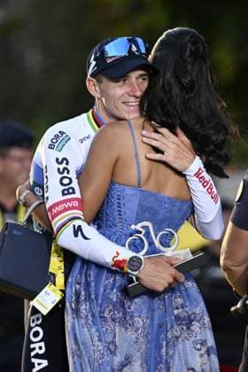 Belgian Remco Evenepoel and his wife Oumaima Oumi Rayane are pictured after stage 21 of the 2026 Tour de France cycling race, a stage of 130km from Thoiry to Paris Champs-Elysees , on Sunday 26 July 2026. The 113th edition of the Tour de France starts on Saturday 4 July in Barcelona, Spain, and will finish in Paris, France on the 26th of July. JASPERxJACOBS  x182112459x