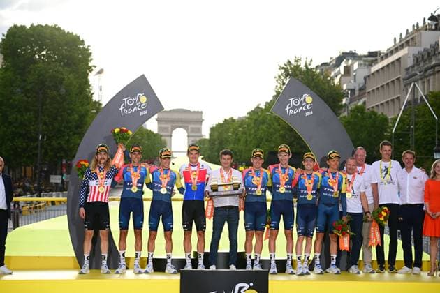 Tour de France 2026 Stage 21 PARIS CHAMPS-ELYSEES, FRANCE - JULY 26 : team Lidl - Trek, Ayuso Juan (ESP) of Lidl - Trek, Gee-West Derek (CAN) of Lidl - Trek, Pedersen Mads (DEN) of Lidl - Trek, Simmons Quinn (USA) of Lidl - Trek, Skjelmose Mattias (DEN) of Lidl - Trek, Skujins Toms (LAT) of Lidl - Trek, Vacek Mathias (CZE) of Lidl - Trek, Verona Carlos (ESP) of Lidl - Trek pictured during the podium ceremony of the 113rd edition of Tour de France an UCI World Tour 2.UWT cycling road race stage for Men Elite of 130 km with start in Thoiry and finish in Paris Champs-Elysees on July 26, 2026 in Paris Champs-Elysees, France, 26 07 2026 Paris Champs-Elysees France  Copyright: xBernardxPaponx