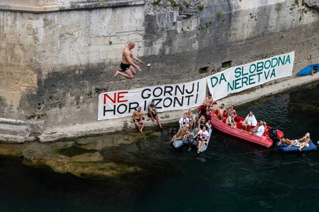 Mostar Old Bridge Diving Competition A participant dives from historical Old Bridge , also known as Mostar Bridge during the traditional diving competition event, 460th Traditional Mostar Old Bridge Diving Competition, in Mostar, Bosnia and Herzegovina on July 26, 2026. Each year, thousands of spectators watch the event across the Old Bridge that crosses Neretva river.  DenisxKapetanovic PIXSELL