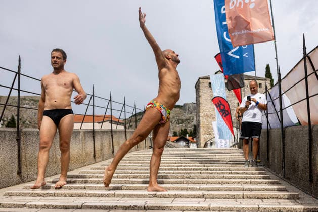 Mostar Old Bridge Diving Competition A participant dives from historical Old Bridge , also known as Mostar Bridge during the traditional diving competition event, 460th Traditional Mostar Old Bridge Diving Competition, in Mostar, Bosnia and Herzegovina on July 26, 2026. Each year, thousands of spectators watch the event across the Old Bridge that crosses Neretva river.  DenisxKapetanovic PIXSELL