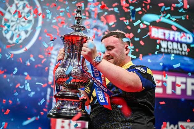 RECORD DATE NOT STATED 26th July 2026, Winter Gardens, Blackpool, Lancashire, England; 2026 Betfred World Matchplay Darts, Mens, Final Day; Luke Littler celebrates winning his final match against Gerwyn Price and holds the Betfred World Matchplay trophy as the confetti falls GodfreyxPitt
