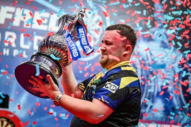 RECORD DATE NOT STATED 26th July 2026, Winter Gardens, Blackpool, Lancashire, England; 2026 Betfred World Matchplay Darts, Mens, Final Day; Luke Littler celebrates winning his final match against Gerwyn Price and holds the Betfred World Matchplay trophy as the confetti falls GodfreyxPitt