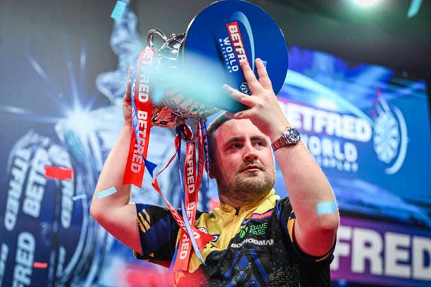 RECORD DATE NOT STATED 26th July 2026, Winter Gardens, Blackpool, Lancashire, England; 2026 Betfred World Matchplay Darts, Mens, Final Day; Luke Littler celebrates winning his final match against Gerwyn Price and holds the Betfred World Matchplay trophy GodfreyxPitt