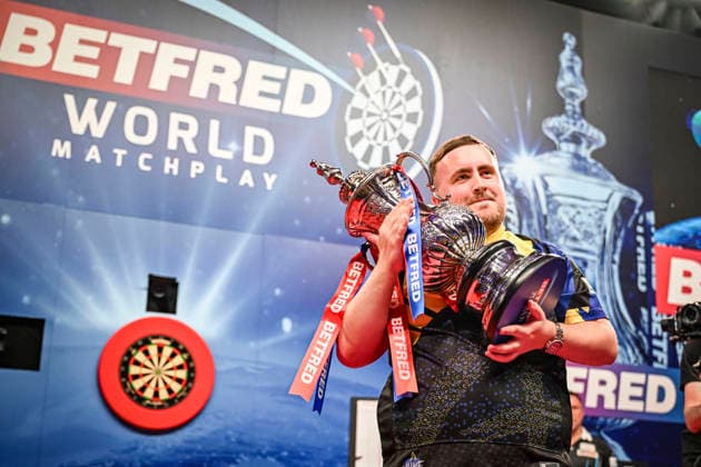 RECORD DATE NOT STATED 26th July 2026, Winter Gardens, Blackpool, Lancashire, England; 2026 Betfred World Matchplay Darts, Mens, Final Day; Luke Littler celebrates winning his final match against Gerwyn Price and holds the Betfred World Matchplay trophy GodfreyxPitt