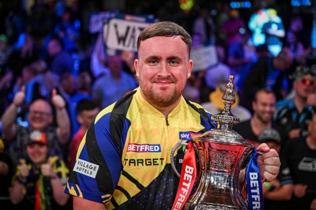 RECORD DATE NOT STATED 26th July 2026, Winter Gardens, Blackpool, Lancashire, England; 2026 Betfred World Matchplay Darts, Mens, Final Day; Luke Littler celebrates winning his final match against Gerwyn Price and holds the Betfred World Matchplay trophy GodfreyxPitt