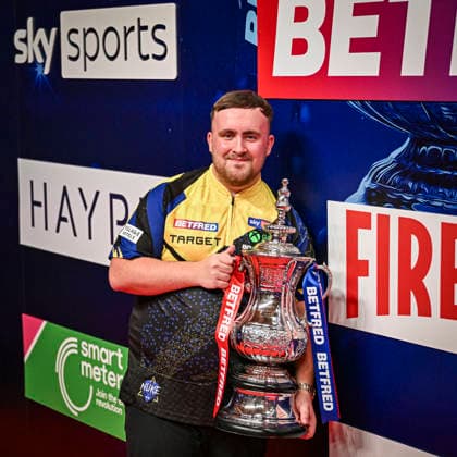 RECORD DATE NOT STATED 26th July 2026, Winter Gardens, Blackpool, Lancashire, England; 2026 Betfred World Matchplay Darts, Mens, Final Day; Luke Littler celebrates winning his final match against Gerwyn Price and holds the Betfred World Matchplay trophy GodfreyxPitt