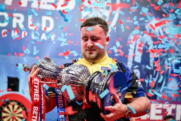 RECORD DATE NOT STATED 26th July 2026, Winter Gardens, Blackpool, Lancashire, England; 2026 Betfred World Matchplay Darts, Mens, Final Day; Luke Littler celebrates winning his final match against Gerwyn Price and holds the Betfred World Matchplay trophy as the confetti falls GodfreyxPitt