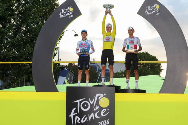 Paris, France REMCO EVENEPOEL (BEL) (RED BULL - BORA - HANSGROHE), Tadej Pogacar (UAE Team Emirates XRG) (SLO) celebrates on the podium in the yellow jersey, Isaac Del Toro (MEX) (UAE Team Emirates XRG) celebrates on the podium in the white jersey ceremony de Podium the Champs-ElysÃ es, Stage 21 of the Tour de France 2026 from Thoiry to Paris (Champs-ElysÃ es) on July 26, 2026, in Paris, France *** Paris, France: REMCO EVENEPOEL BEL RED BULL BORA HANSGROHE; Tadej Pogacar of UAE Team Emirates XRG SLO celebrates on the podium in the yellow jersey, Isaac Del Toro MEX UAE Team Emirates XRG celebrates on the podium in the white jersey at the podium ceremony on the Champs-Élysées, Stage 21 of the 2026 Tour de France from Thoiry to the Champs-Élysées in Paris on July 26, 2026, in Paris, France Copyright: HMBxMedia JoaquimxFerreira
