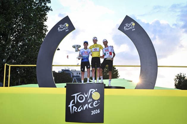 Tour de France arrival in Paris - Tropies FA Tadej Pogacar (C) reacts with Isaac Del Toro (R) and Mathieu Van Der Poel (L) during the trophy ceremony at the end of the 21st step of the Tour de France at the Champs-Elysees in Paris on July 26, 2026. Photo by Firas Abdullah ABACAPRESS.COM Paris Ile-de-France France  Copyright: xAbdullahxFiras ABACAx