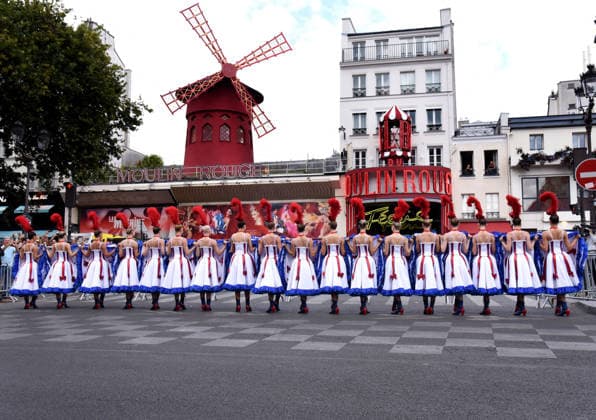 Tour De France In Front Of The Moulin Rouge - Paris French Cancan wild to welcome the passage of the Tour de France in front of the Moulin Rouge in Paris, France on July 26, 2026. Photo by Alain Apaydin ABACAPRESS.COM Paris France  Copyright: xApaydinxAlain ABACAx
