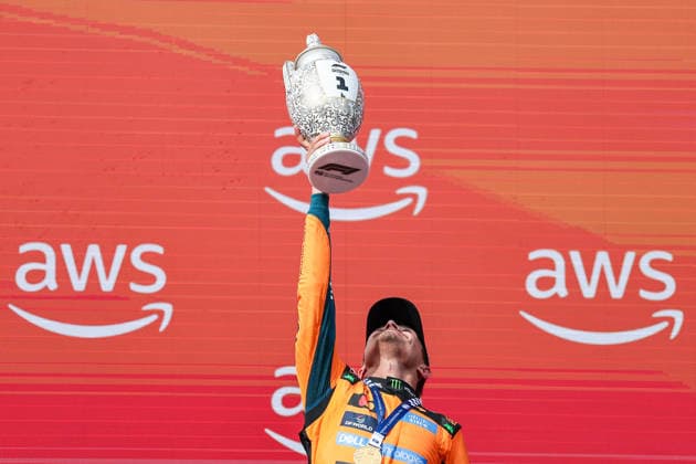 (260727) -- MOGYOROD, July 27, 2026 -- McLaren s British driver Lando Norris lifts the trophy during the awarding ceremony after the Formula One Hungarian Grand Prix at the Hungaroring in Mogyorod, near Budapest, Hungary, July 26, 2026. (Photo by Xinhua) (SP)HUNGARY-MOGYOROD-F1-HUNGARIAN GRAND PRIX-RACE BaoxDi 