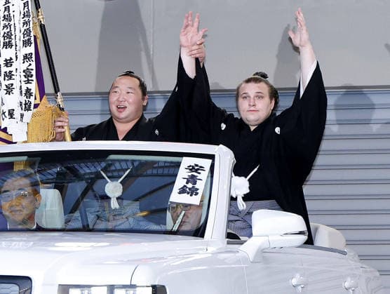 Nagoya Grand Sumo Tournament Sekiwake Aonishiki (R) celebrates during a parade held after he won the 15-day Nagoya Grand Sumo Tournament in Nagoya, central Japan, on July 26, 2026.  A14AA0005624093P