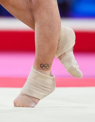 Elsabeth Black of Canada performs on the floor during the third rotation of the Artistic Gymnastics Women s All-Around Final. Picture shows detail of Olympic Rings tattoo on Elsabeth Black s left ankle. Glasgow 2026 Commonwealth Games, Day Four, Glasgow, Scotland, UK - 26 Jul 2026Glasgow Scotland United Kingdom  Copyright: xStuartxWallace Shutterstockx 17005518bx