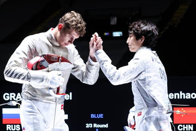 CHINA, HONG KONG - JULY 27, 2026: Russia s Pavel Graudyn (L) and China s Wei Zhenhao compete in the men s individual sabre event at the 2026 Kerry Fencing World Championships. Mikhail Sinitsyn TASS  95533394